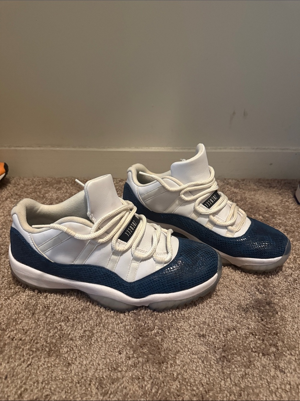 Air Jordan 11’s Retro Low-Top Sneakers in White and Navy